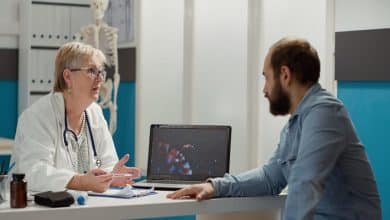 female medic looking coronavirus illustration laptop with sick patient talking about medication prevention virus animation display cure disease medical cabinet 482257 45670