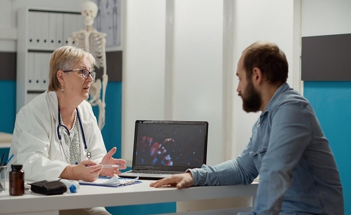 female medic looking coronavirus illustration laptop with sick patient talking about medication prevention virus animation display cure disease medical cabinet 482257 45670