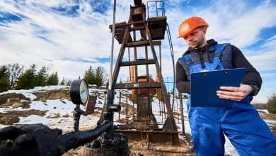 petroleum engineer inspecting pump jack oil field 651396 2144