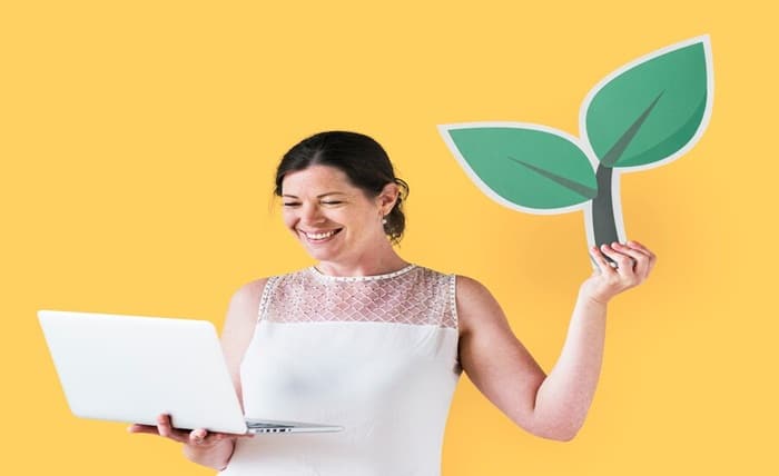 woman holding plant icon using laptop 53876 65371