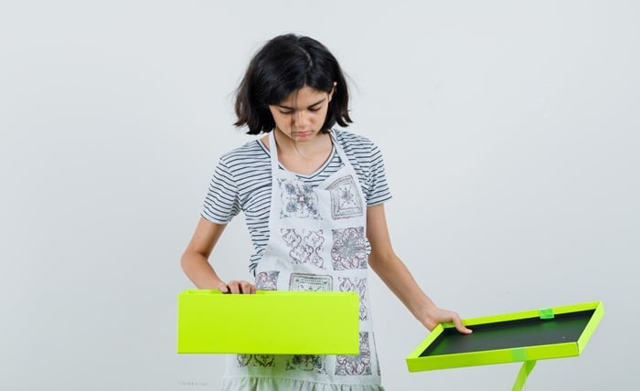 little girl looking into present box t shirt apron 176474 40163