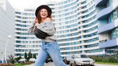 outdoor image joyful girl black wool hat grey fall sweater jumping enjoying walk modern urban city 273443 1874