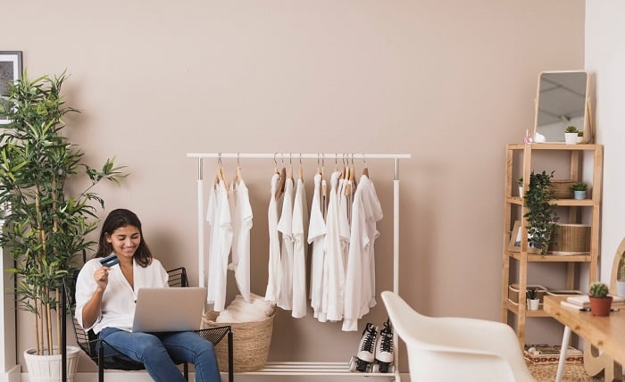 woman holding credit card working laptop 23 2148304900