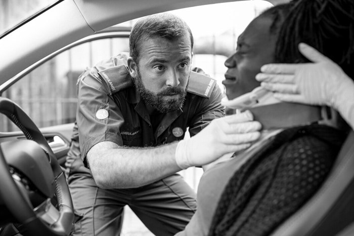 paramedic placing cervical collar injured woman from car accident 53876 146582