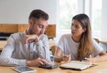 serious students discussing homework using digital devices 1262 17201