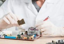 close up male technician holding computer chip 23 2147922370