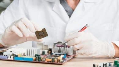close up male technician holding computer chip 23 2147922370