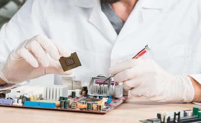 close up male technician holding computer chip 23 2147922370