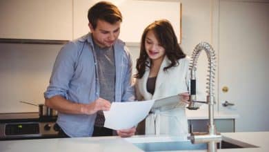 couple discussing digital tablet kitchen 107420 84887