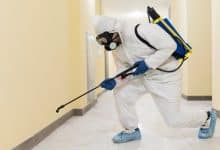 full shot man disinfecting building 23 2148926653