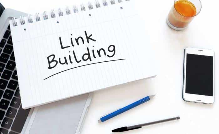 link building notepad on desk jpg