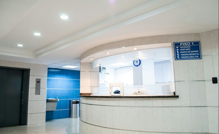 The image depicts a serene and modern dermatology clinic in Austin, focusing on advanced skin care treatments with a calming color palette of blues and whites, subtly incorporating Austin's unique landscape elements like rolling hills and urban architecture.