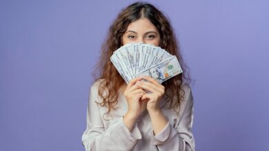 young pretty girl covered face with money 141793 81535