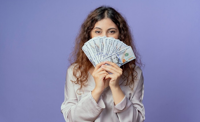 young pretty girl covered face with money 141793 81535