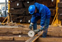 worker cuts iron with tool 140725 7623